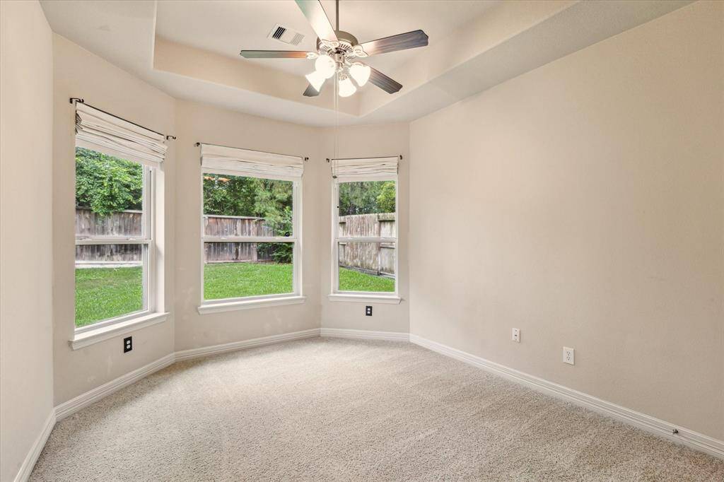 Bright and airy, this 3rd bedroom is a versatile room perfect for guests, kids, or a intimate reading nook.