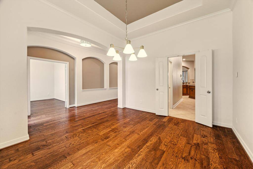 A true showstopper as you enter the home, this formal dining room sits just across from the home office and sets the tone with its warm hardwood floors.