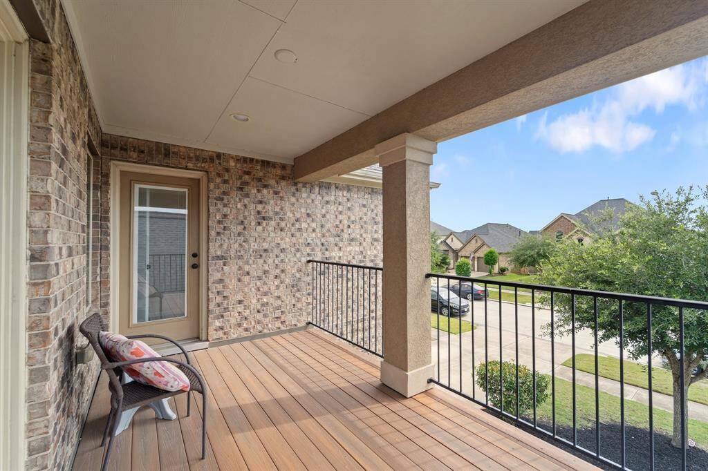 Two secondary bedrooms have balcony access