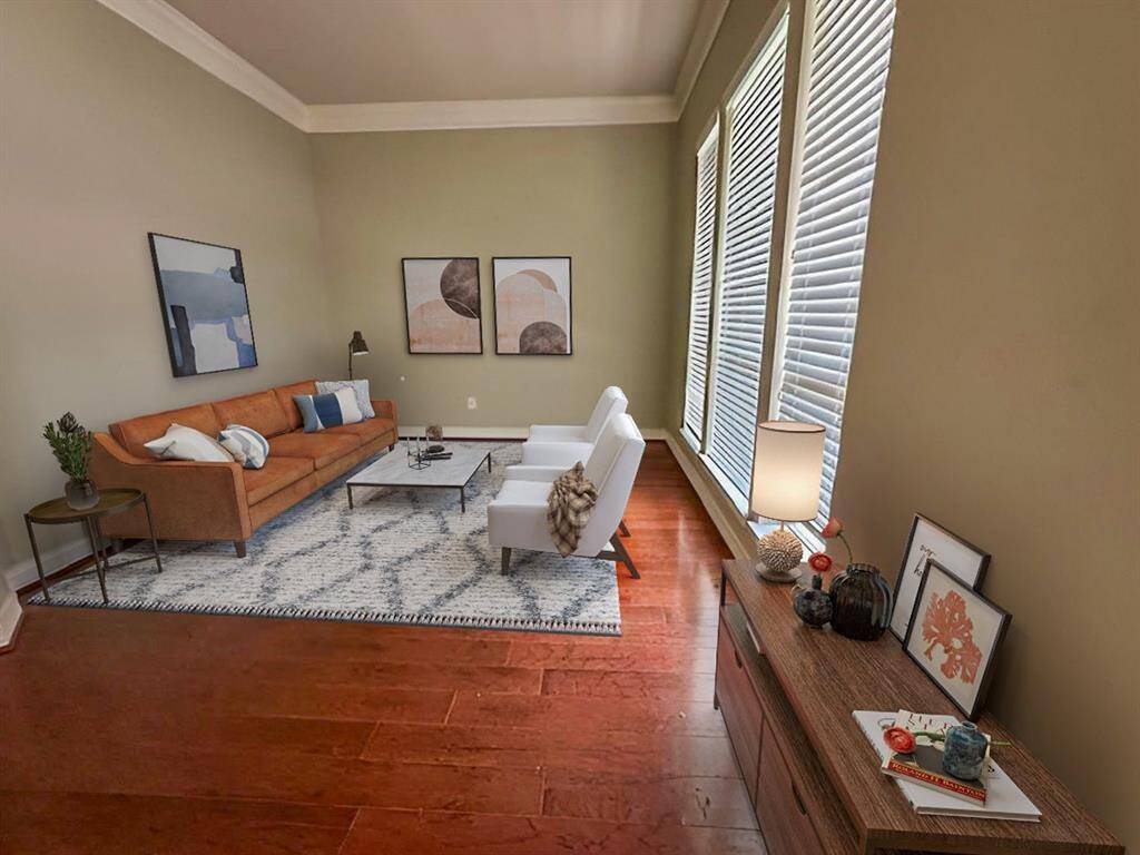 This photo has been virtually staged to show how furniture can be arranged in the space