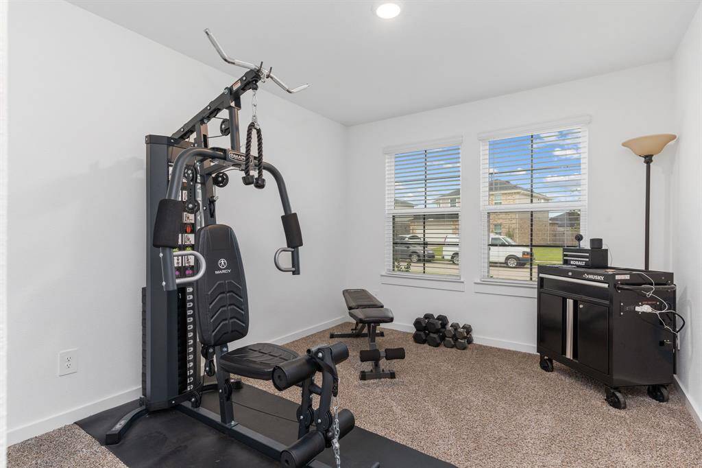 Bedroom 1, currently being used as a gym.