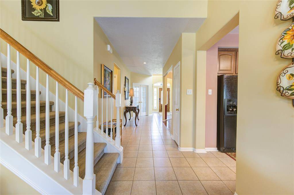 The stairs take you to the gameroom, guest bedrooms and full baths
