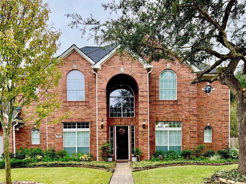 318 Winding Oak Lane is located within the gates of Oak Creek.