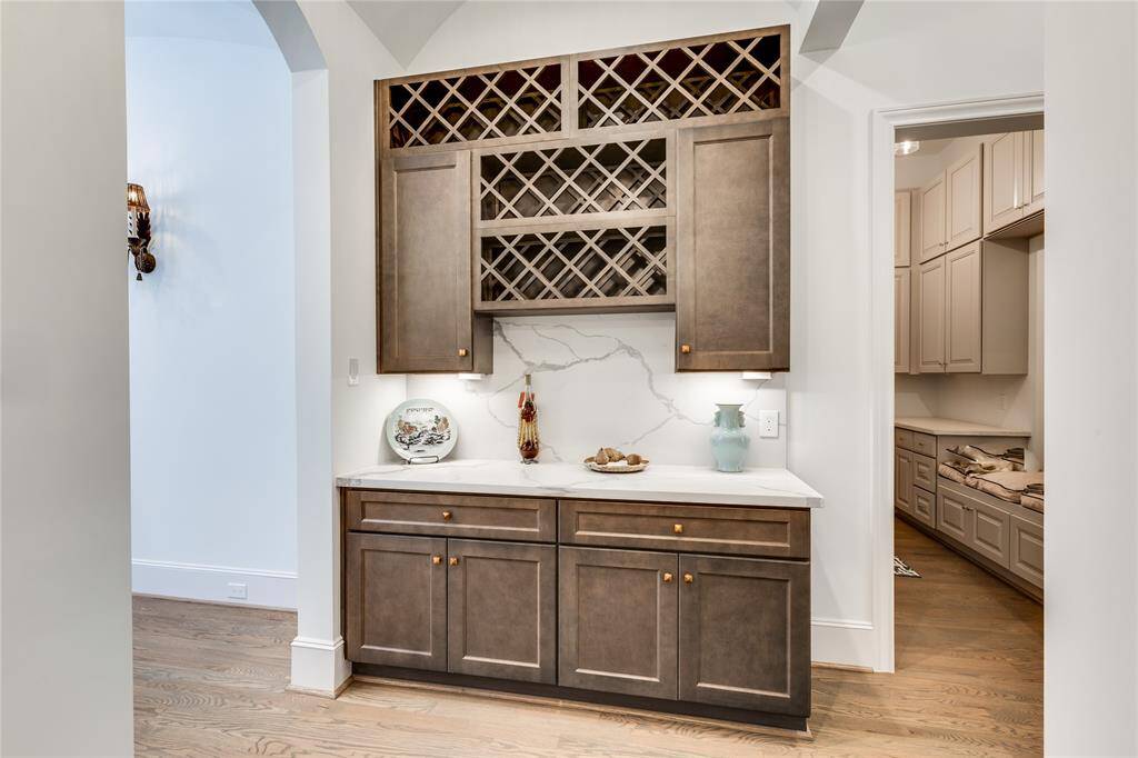alternate view of wine bar, connected to mud room with built-in cabinets and plenty of storage