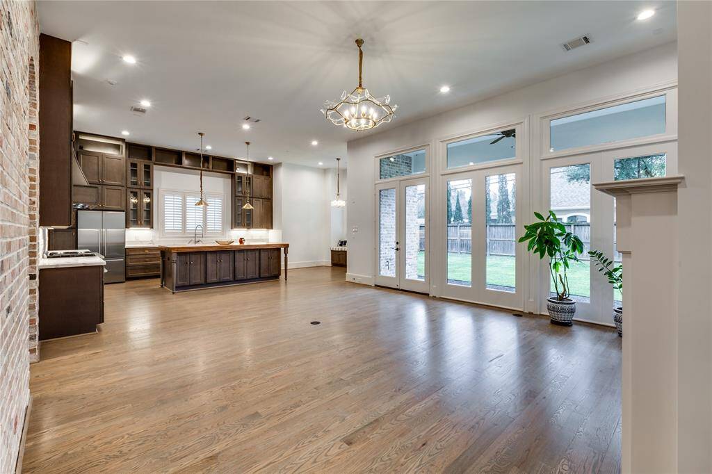 from living/family room looking into the open kitchen; large open windows to backyard