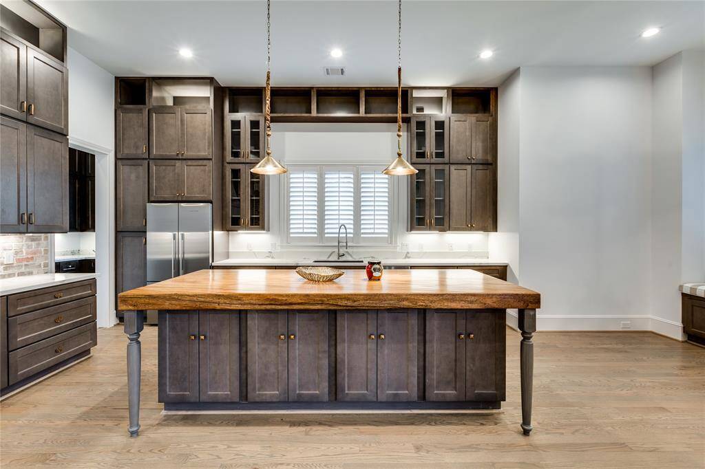 Big kitchen window with wood shutter