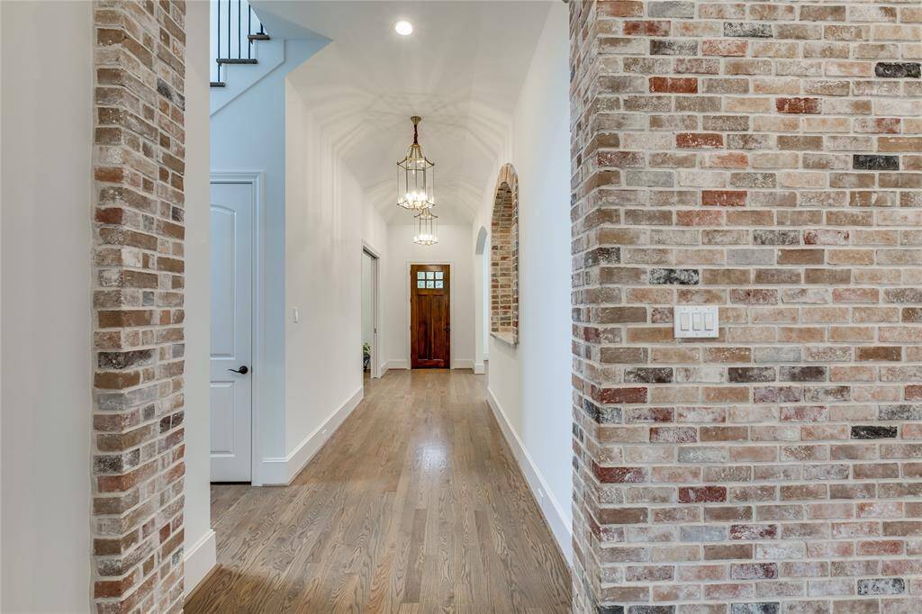 From family room looking to the entry door, 100% brass birds nest lighting fixtures
