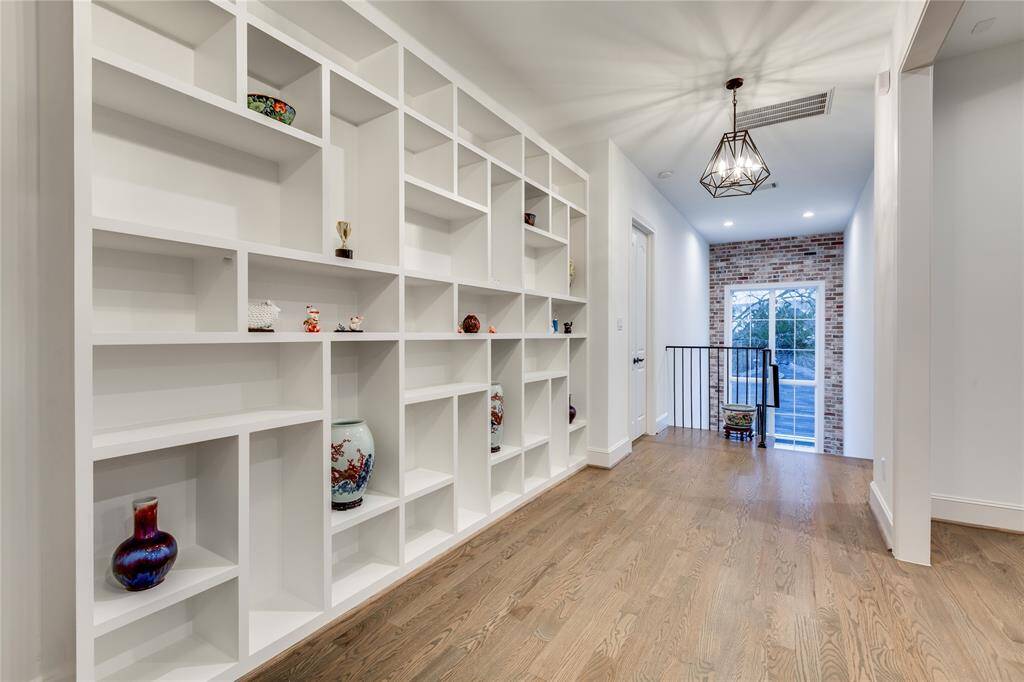 upstairs hallway with custom built-in to show case your collections