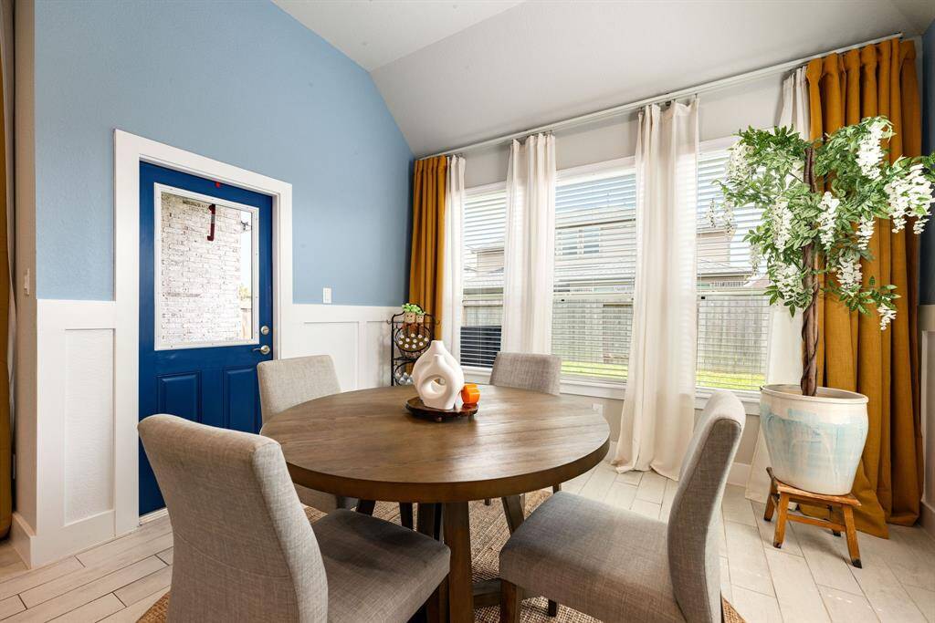 Start your day off right with a cup of coffee sitting with your family in the lovely breakfast area! Featuring large windows with blinds, custom neutral paint, tile flooring, recessed lighting and high ceilings.