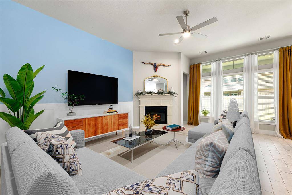 Gather the family and guests together in your lovely living room! Featuring soaring high ceilings, recessed lighting, dark stained ceiling fan, custom paint, gorgeous tile floors and large windows that provide plenty of natural lighting throughout the day. *Virtually Staged