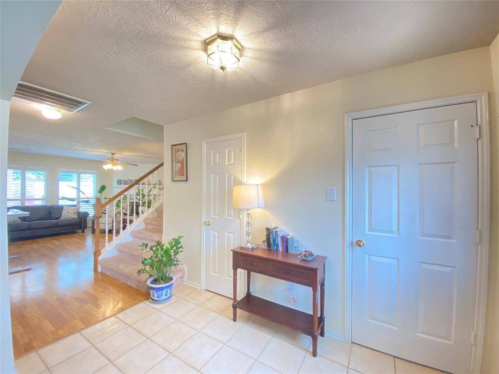 Spacious welcome area, Easy to access laundry room and a half bathroom.