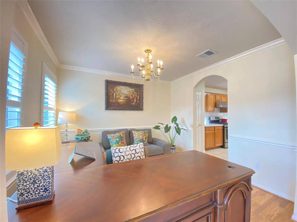 Formal dining or home office right at entry.