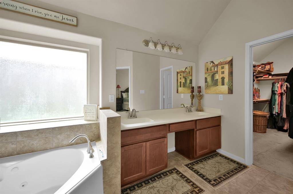 Primary bath with dual vanities.