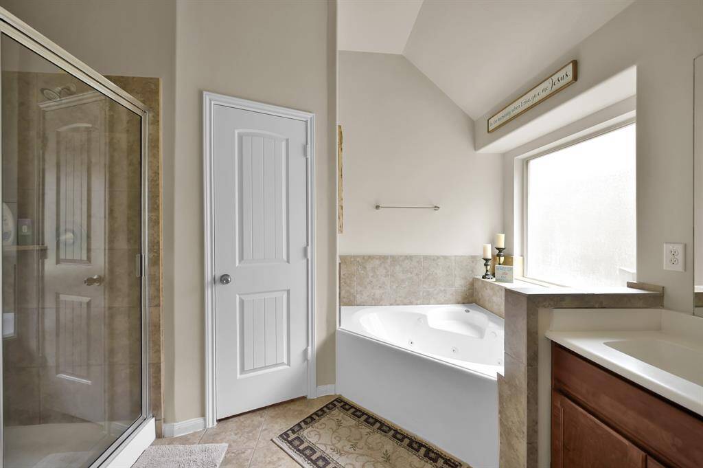 Separate shower and jetted tub.