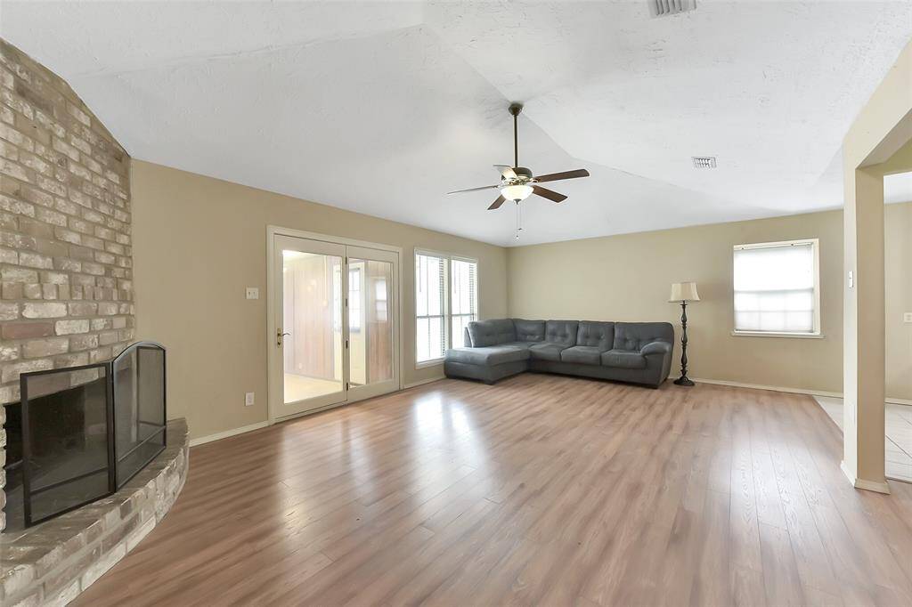 Large living area with a fireplace. Great for entertaining.