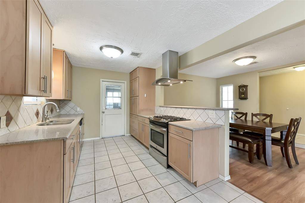 Cook and Connect! The Kitchen opens to the dining area, creating a functional layout for entertaining.