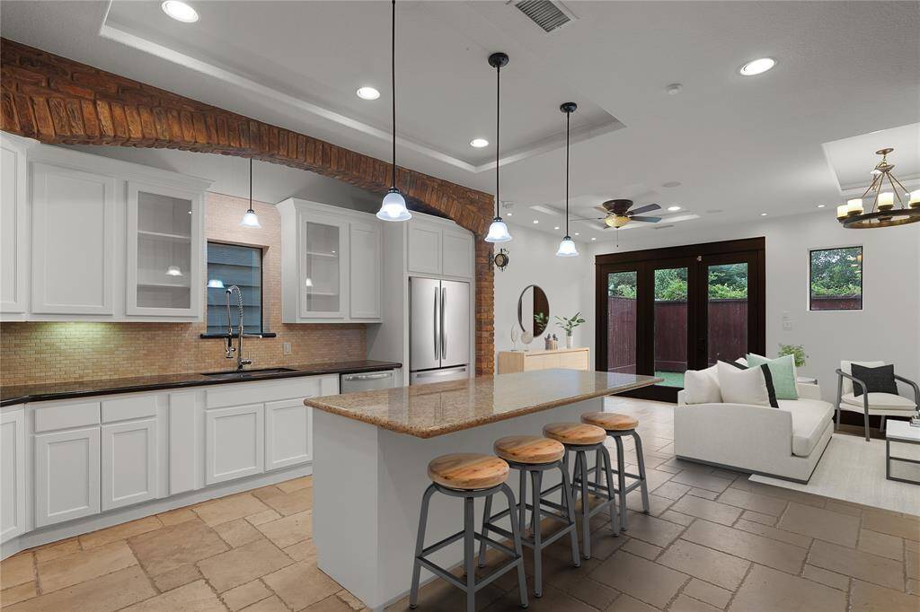 Welcome to this gorgeously renovated home, minutes away from the Heights!