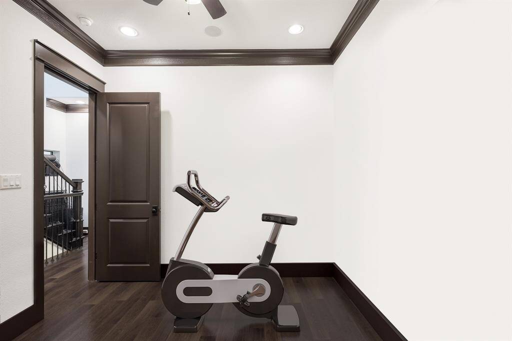 All bedrooms boast high ceilings, and natural light. This one is used as a peloton room.