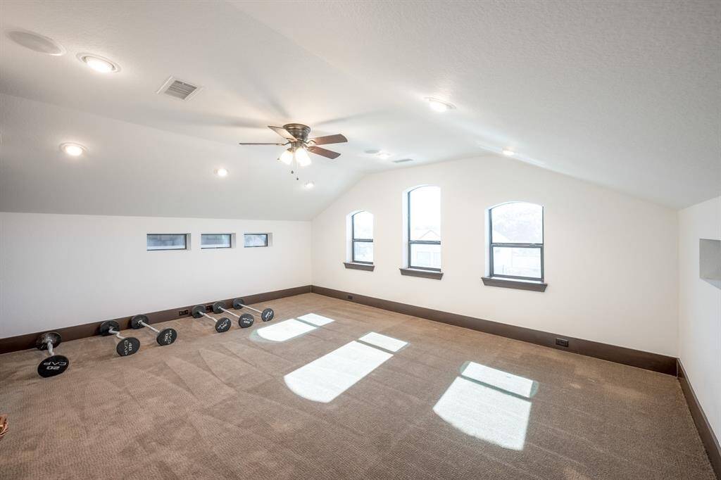 Additional flex space on the third floor, it is currently used as a home gym.