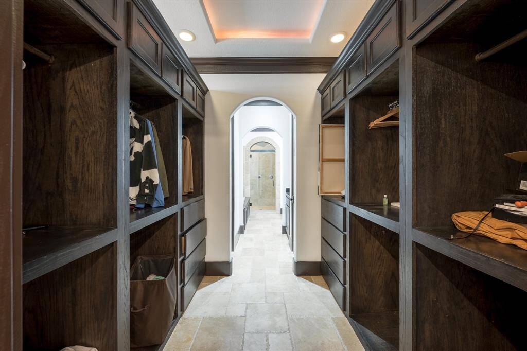 This gorgeous home boasts a custom cedar walk-in closet, and a secondary closet.