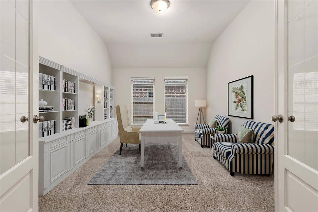 Study with French doors. Virtually staged.