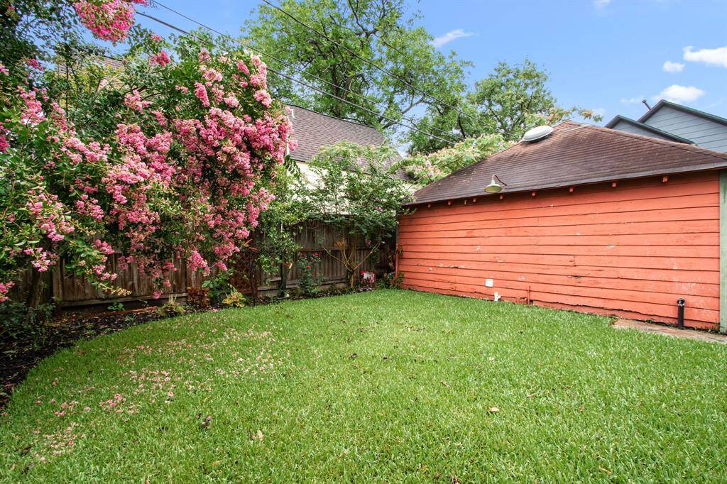 The backyard has room for pets, playscapes, and future plans. A combination on established and fresh plantings provide privacy and a layered visual landscape.