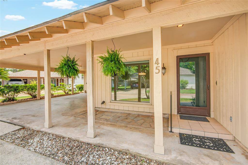 Home has shaded parking and very large picture windows to maintain an open feel.