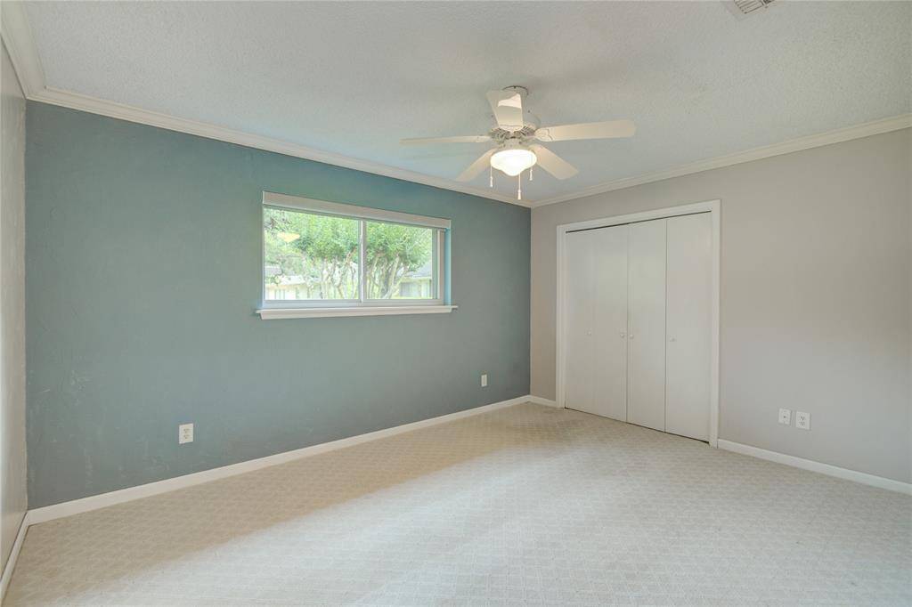 Secondary bedroom with neutral relaxing color palette.