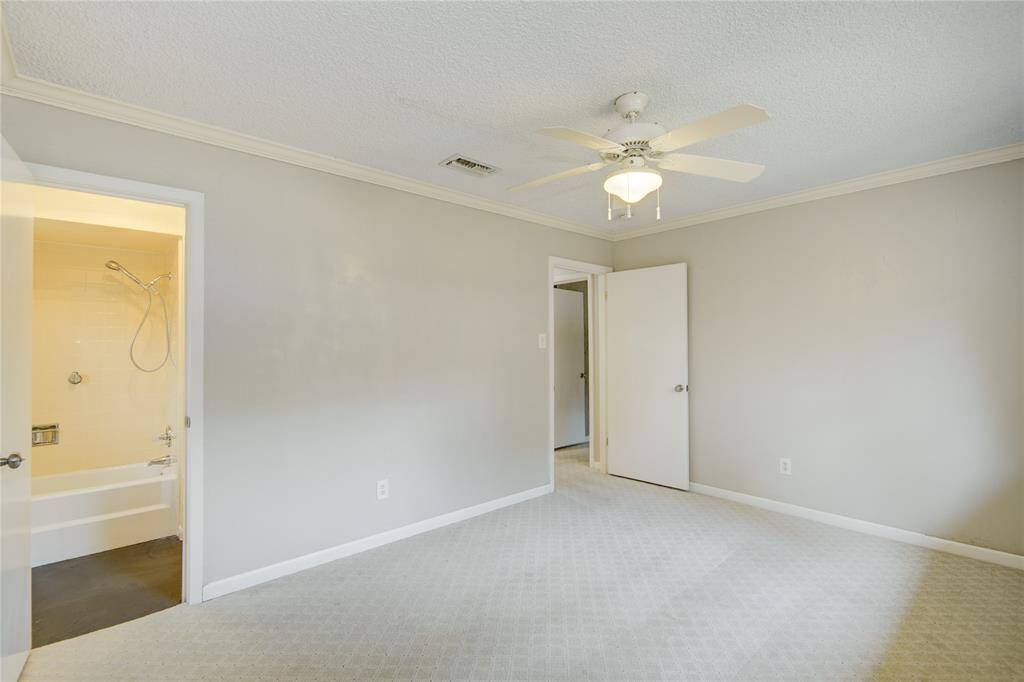 In this view of the secondar bedroom you see into the attached bathroom.