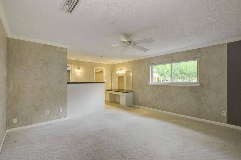 he primary bedroom has a dedicated vanity and added storage, as well as dual closets.