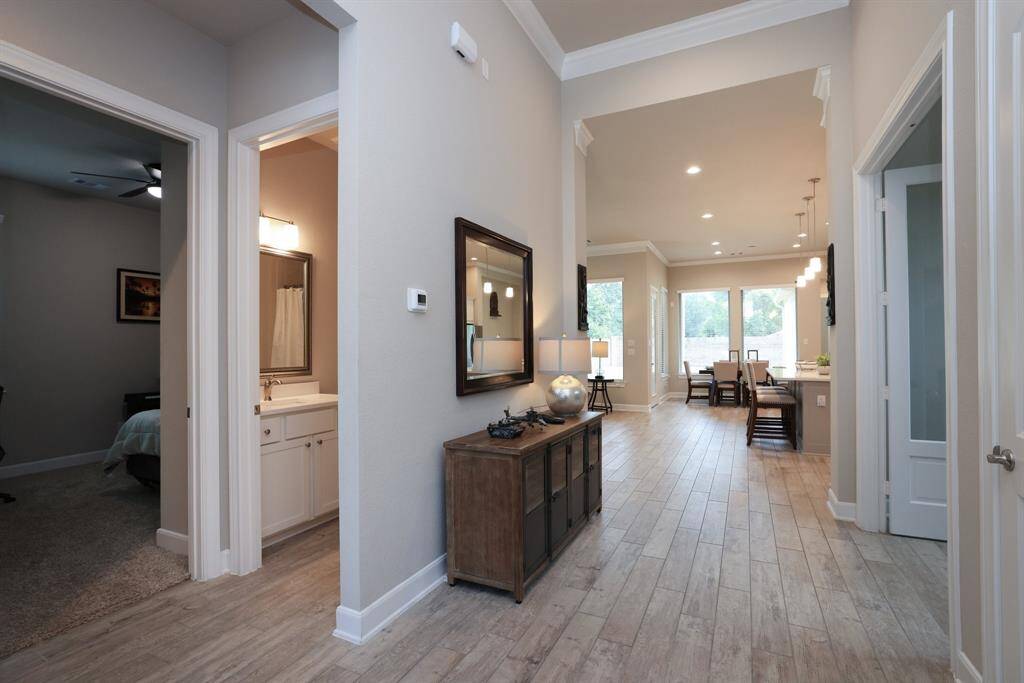 As you tour this Chesmar Home, take note of the thoughtfully designed ceilings and the abundance of natural light that fills the space, creating a bright and welcoming atmosphere throughout.