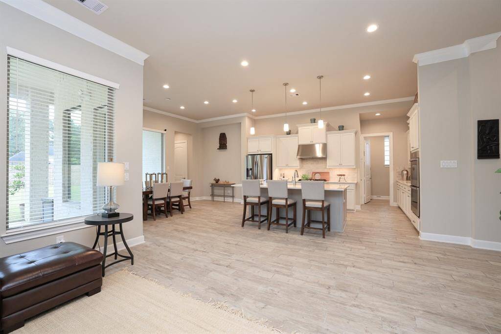 The thoughtful sightlines in this home create an ideal layout for family gatherings and entertaining. You'll love starting and ending your day in the inviting casual dining area, while the spacious kitchen island doubles as the perfect spot for meal prep or a convenient homework station.