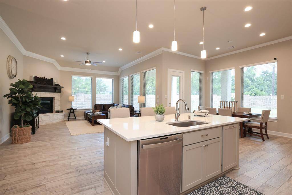 The open sightlines in this home's design offer a seamless flow and an inviting atmosphere.