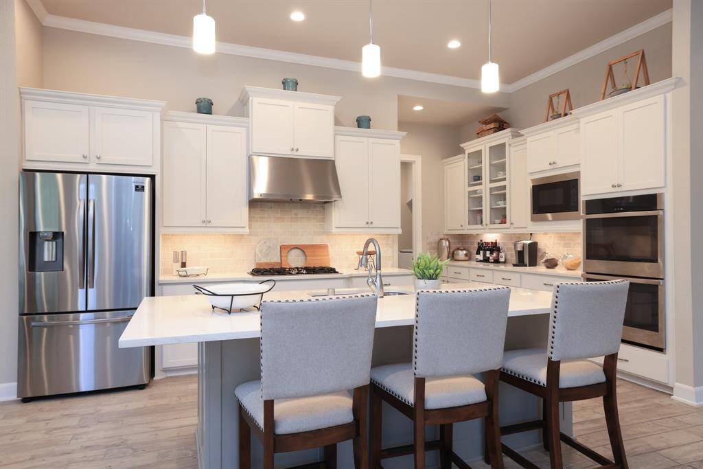 The indoor utility room is conveniently located just behind the kitchen, offering easy access while keeping laundry tasks tucked away from the main living areas.