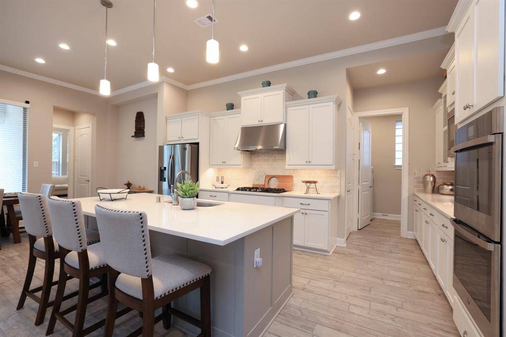 Take note of the abundant storage this kitchen offers, plenty of cabinet and counter space, making it perfect for two chefs to cook and create together with ease.