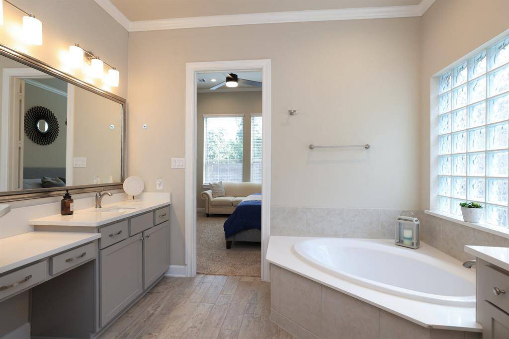 You’ll enjoy starting and ending your day in the spa-like primary bathroom, designed for relaxation with its serene ambiance, thoughtful layout, and elegant finishes.
