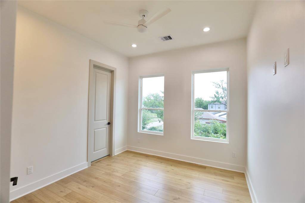 The second bedroom offers a raised TV outlet and two windows, filling the room with natural light and providing the perfect setup for your TV.