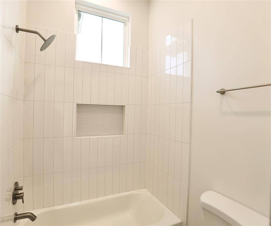Guest shower is brilliantly finished with 4x16 tiles + custom sized large shower nook.