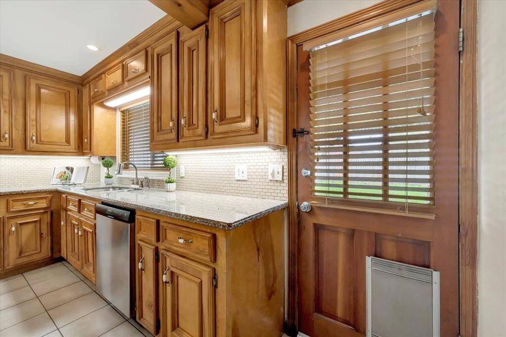 Access the inviting backyard through this convenient rear entrance.