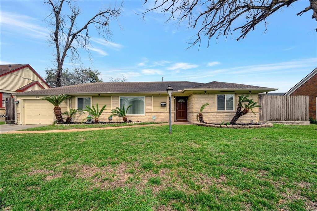 Charming home with excellent curb appeal, featuring a well-maintained lawn and inviting facade.