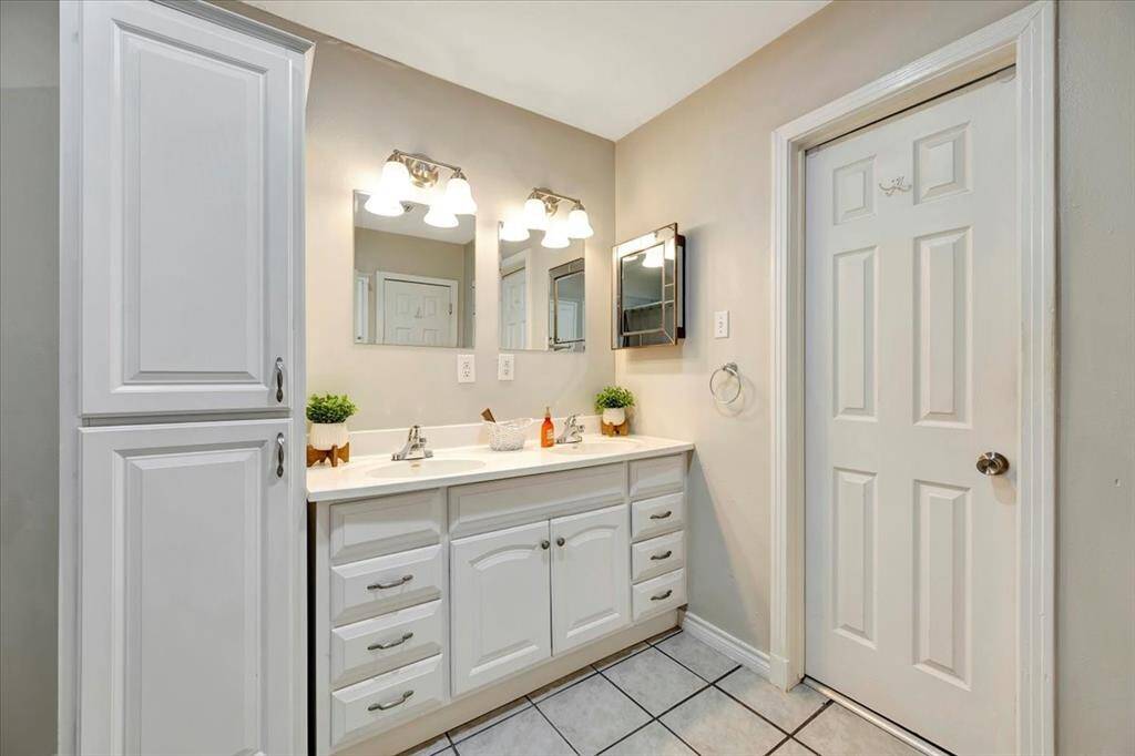 Enjoy the convenience of dual sinks in this primary bathroom.