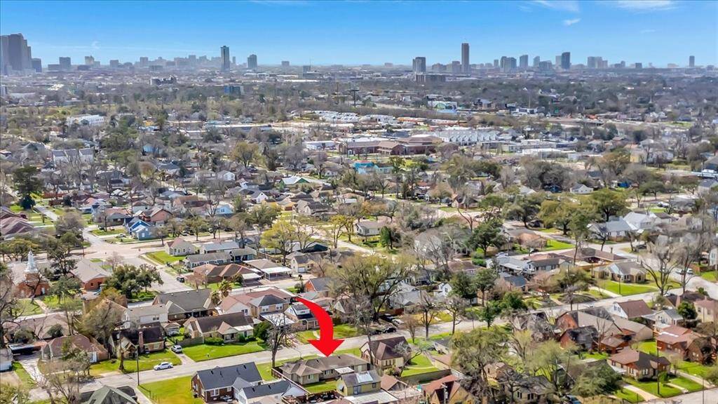 Aerial view showcasing the home's proximity to the city skyline.