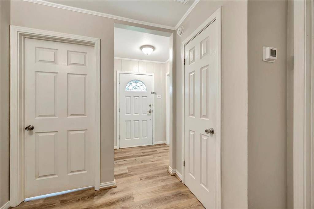 Welcoming entryway with elegant flooring and ample natural light, setting the tone for the rest of the home.