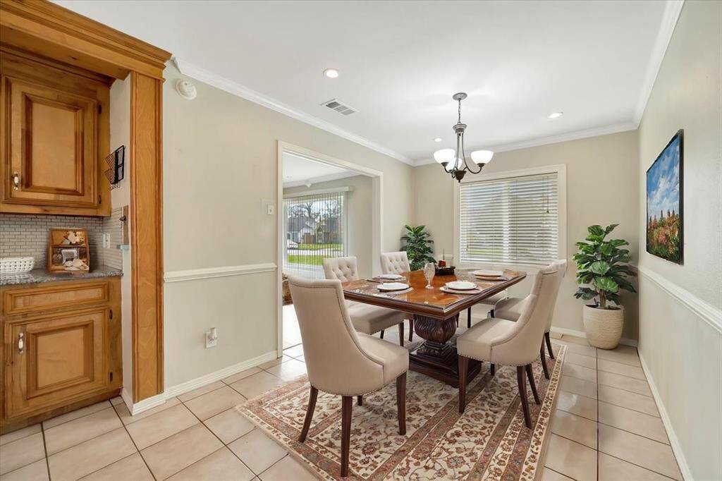 Virtual staging. Bright and inviting dining area with ample natural light streaming through large windows.