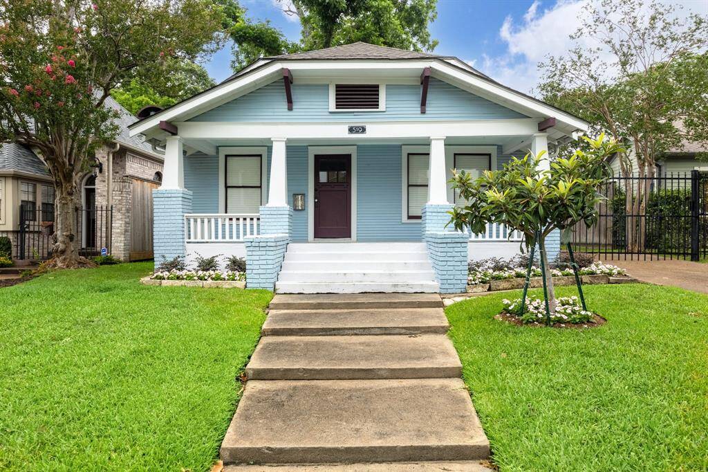 Exuding curb appeal, this quintessential Heights bungalow features a substantial front yard and an adorable front porch, perfect for relaxing and enjoying the neighborhood ambiance. The property is beautifully landscaped, creating a picturesque setting that embodies the charm and character of the Heights.