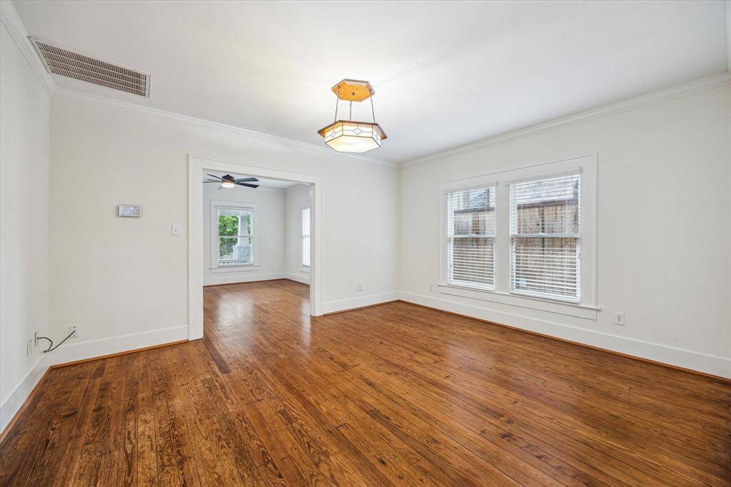 Alternate view of the Dining Room, seamlessly flowing from the Living Room, making it ideal for entertaining. This versatile space is spacious enough to accommodate two distinct areas in one, if desired.