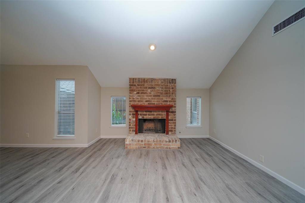 Large living/dining area with gas log fireplace