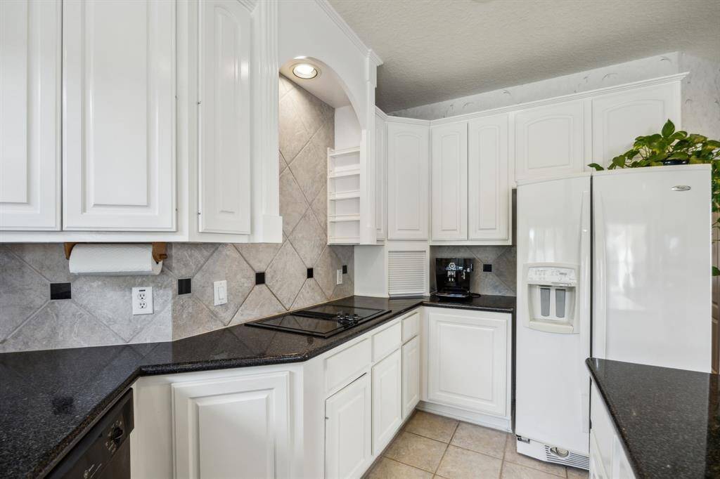 The open layout encourages easy flow between cooking, dining, and entertaining, while the thoughtfully placed windows brighten every corner with warm, natural sunlight. Whether preparing daily meals or hosting special gatherings, this kitchen offers both efficiency and style in one harmonious space.