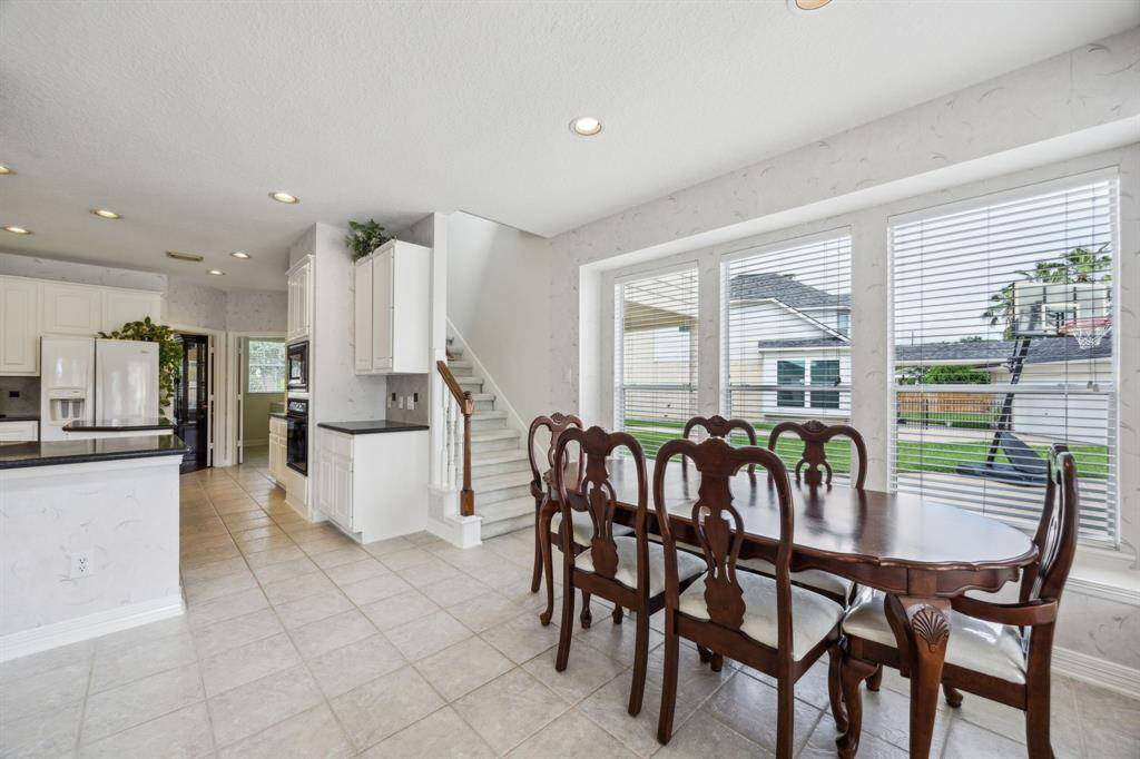 The seamless integration of kitchen, breakfast room, and living area ensures that every gathering—big or small—feels connected and comfortable