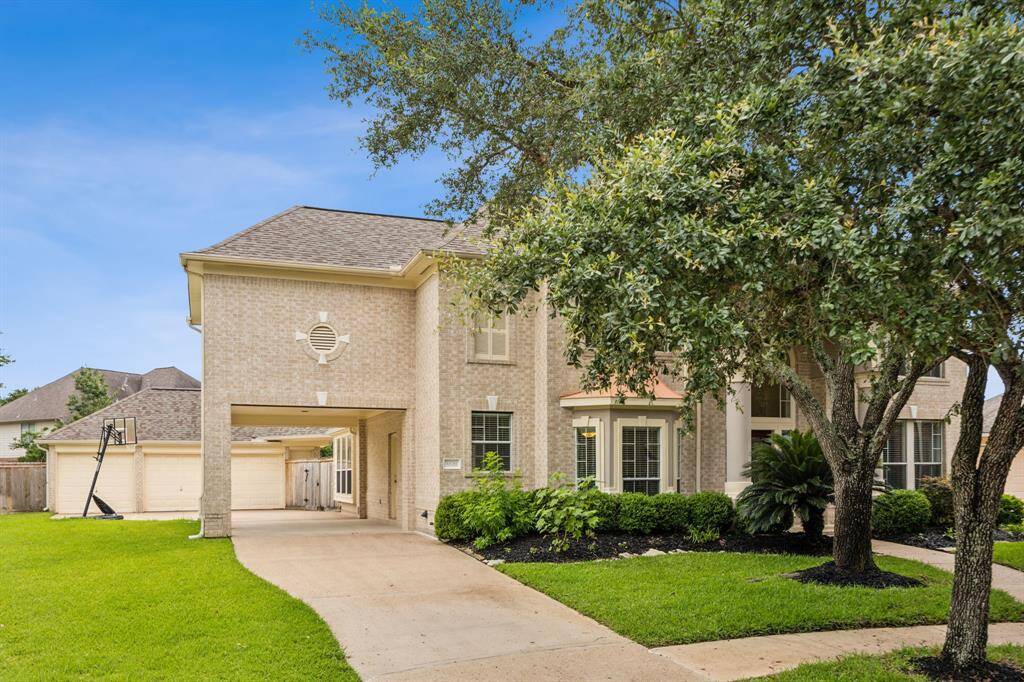 Spacious 3-car garage offering ample room for vehicles, storage, and hobbies.